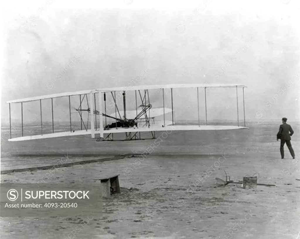 On December 17  1903  at 10:30 am at Kitty Hawk  North Carolina  this airplane arose for a few seconds to make the first powered  heavier-than-air controlled flight in history. The first flight lasted 12 seconds and flew a distance of 120 feet. Orville Wright piloted the historic flight while his brother  Wilbur  observed. The brothers took three other flights that day  each flight lasting longer than the other with the final flight going a distance of 852 feet in 59 seconds. This flight was the