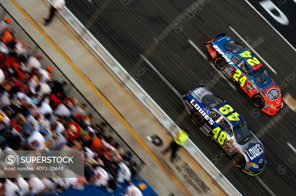 high angle NASCAR Nextel Cup Jeff Gordon Jimmie Johnson grandstands crowd