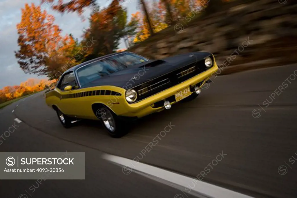 1970 plymouth AAR barracuda driving through the country