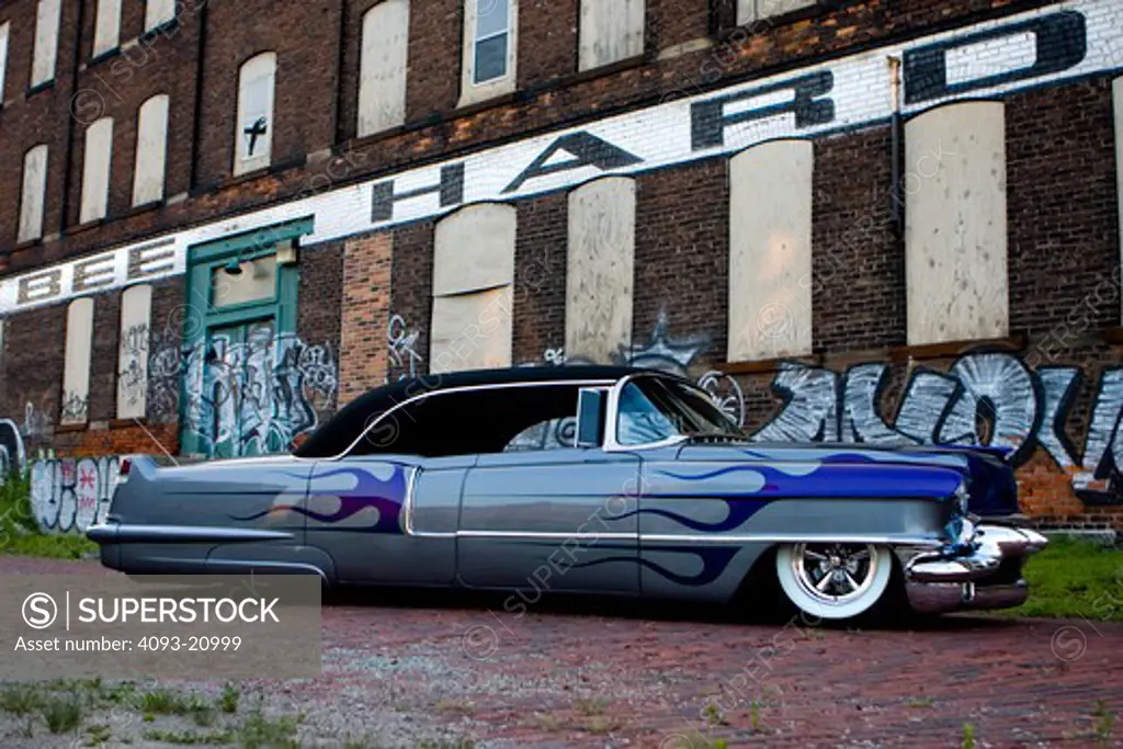 1955 Customized Cadillac Firemaker parked in front of warehouse