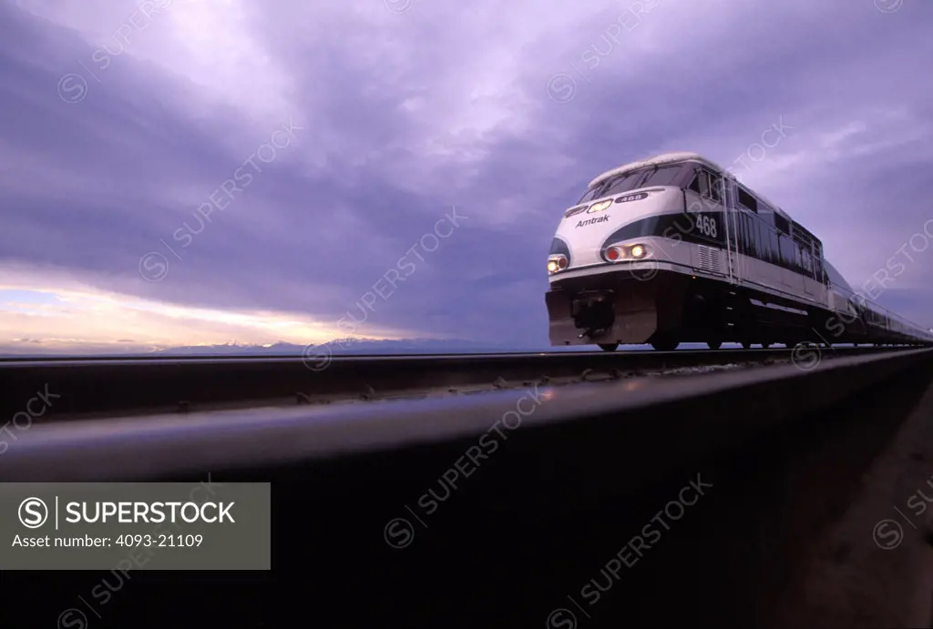 Amtrak Cascades 468 Talgo F59 passenger diesel powered electric locomotive tracks street