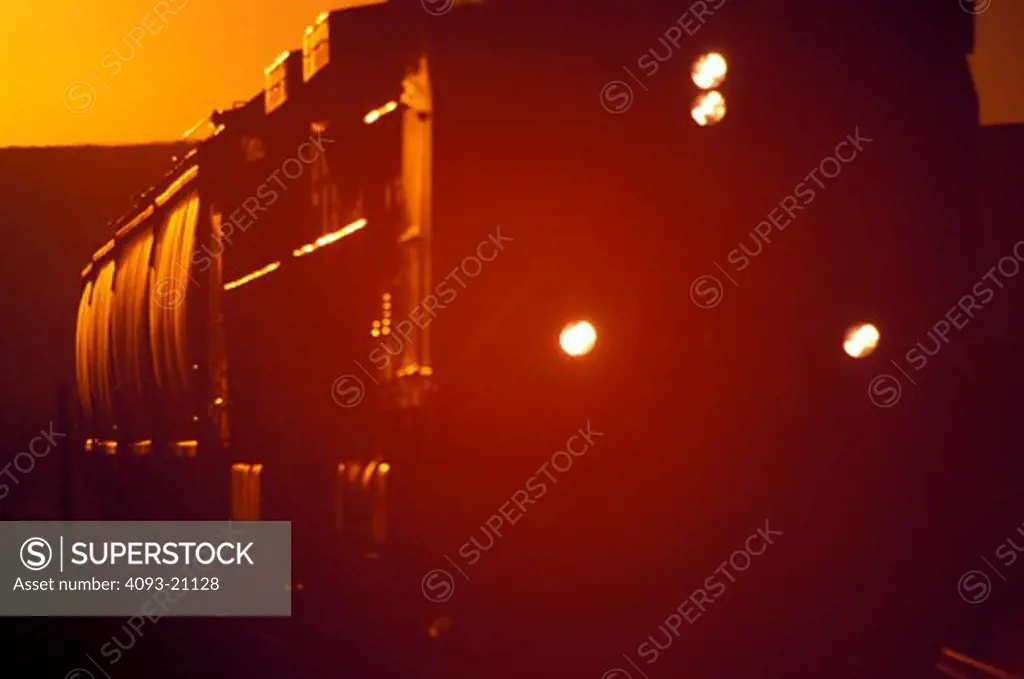 freight locomotive diesel powered electric silhouette lens flare street