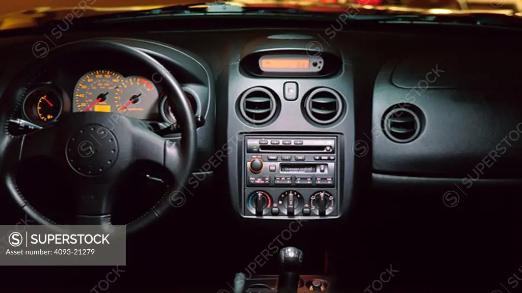 interior detail Mitsubishi 2001 Eclipse dashboard steering wheel black gear shift speedometer tachometer gauges