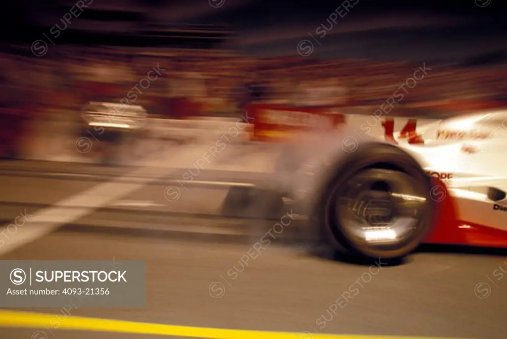Kenny Brack Indy 500 pit lane smoke burnout peeling out burning rubber wheel IRL race car street
