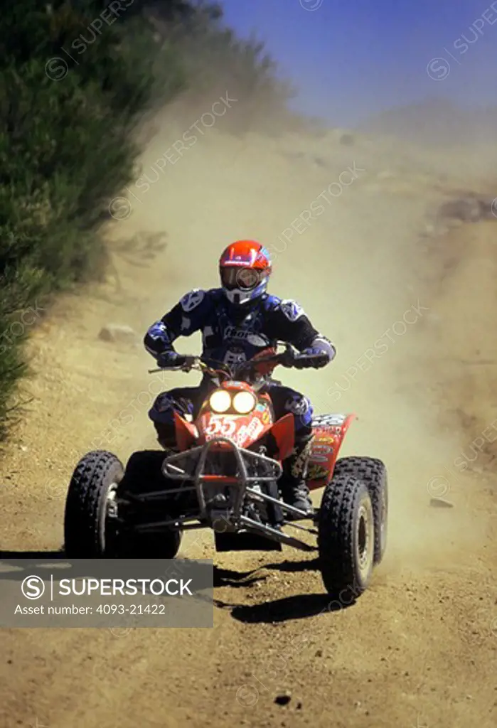 ATV all terrain vehicle four wheeler Baja Mexico dust race car head on