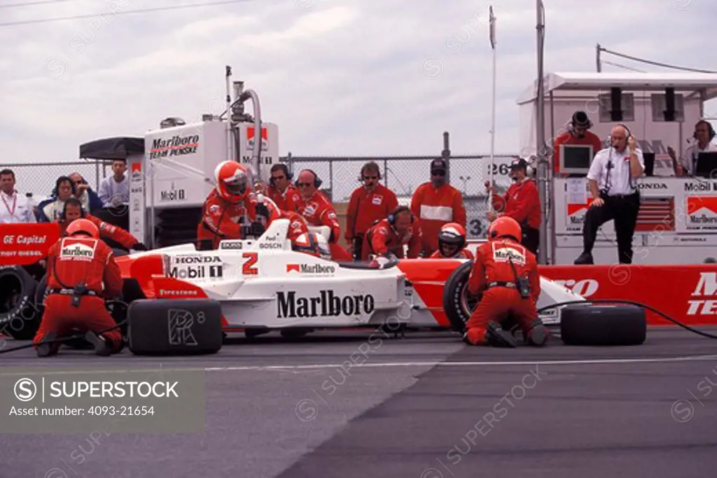 Team Penske CART pit stop crew tire change race car