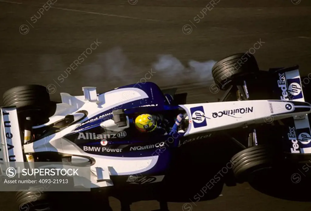 overhead high angle Formula One F1 Ralf Schumacher Williams BMW white blue tire smoke lockup