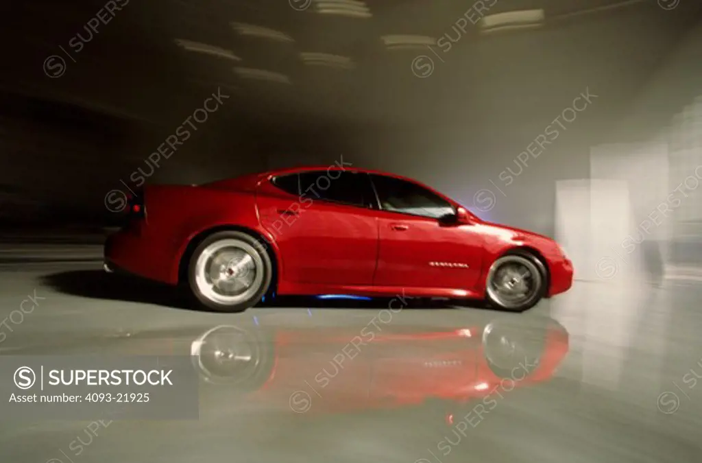 Pontiac Grand Prix G-Force red reflection parking garage