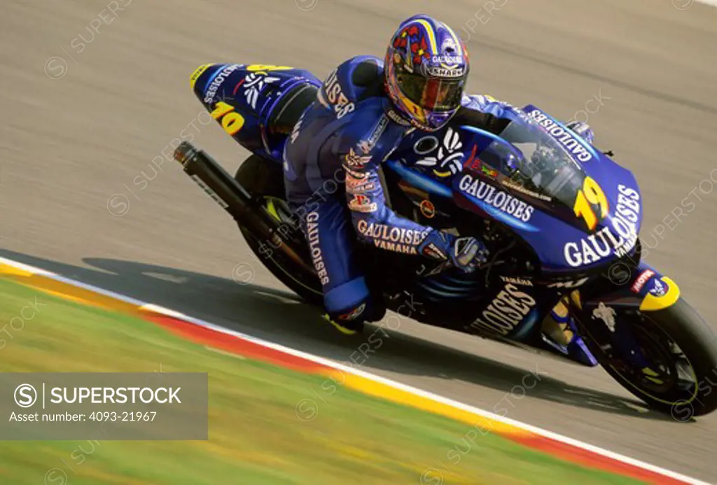 Yamaha MotoGP Olivier Jacque blue lean cornering curb red yellow