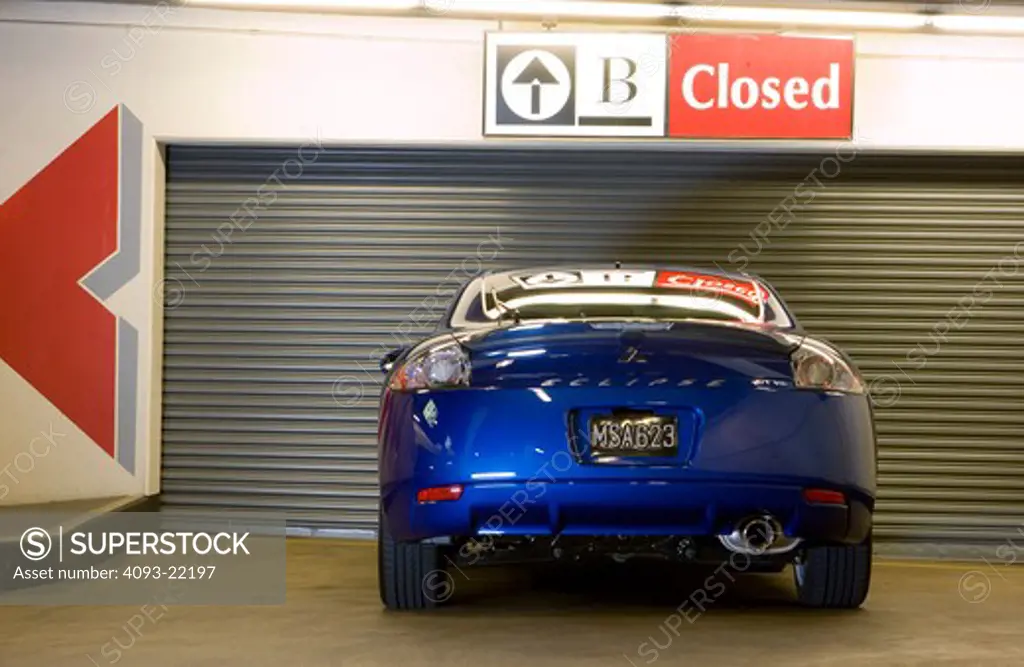 Mitsubishi Eclipse 2006 blue parking garage