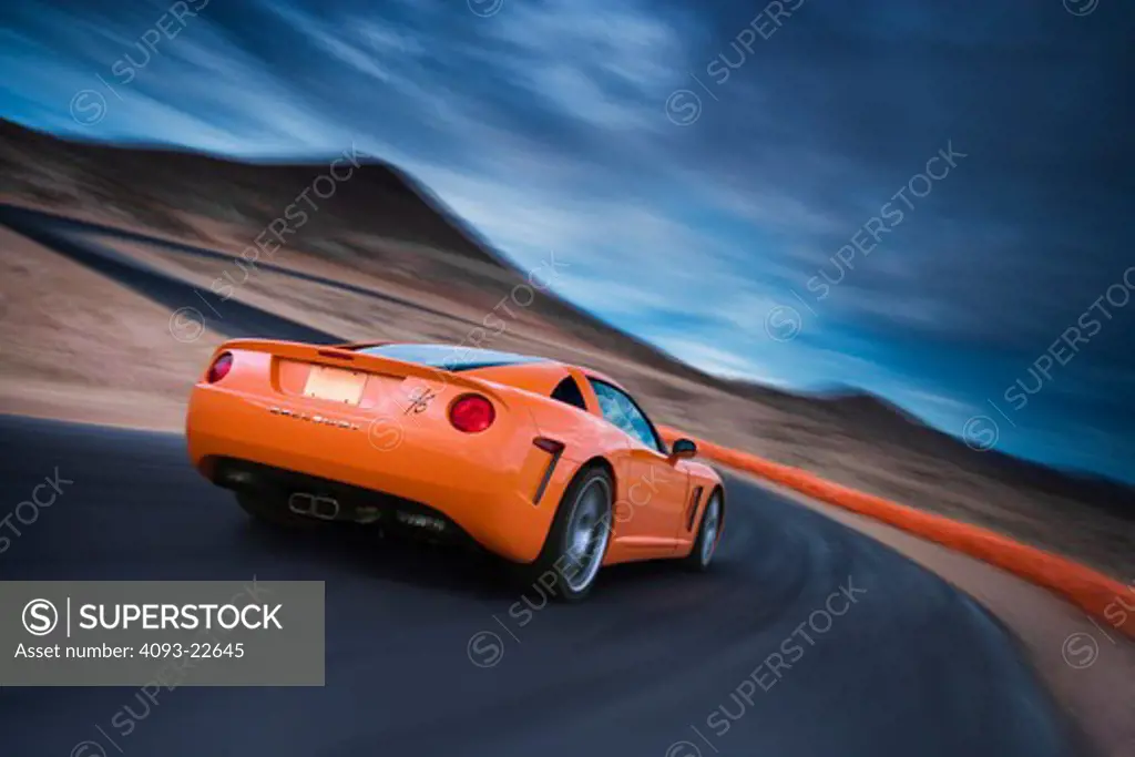 Rear 3/4 action view of a bright orange 2008 Callaway C16. Based on the C6 Chevrolet Corvette.