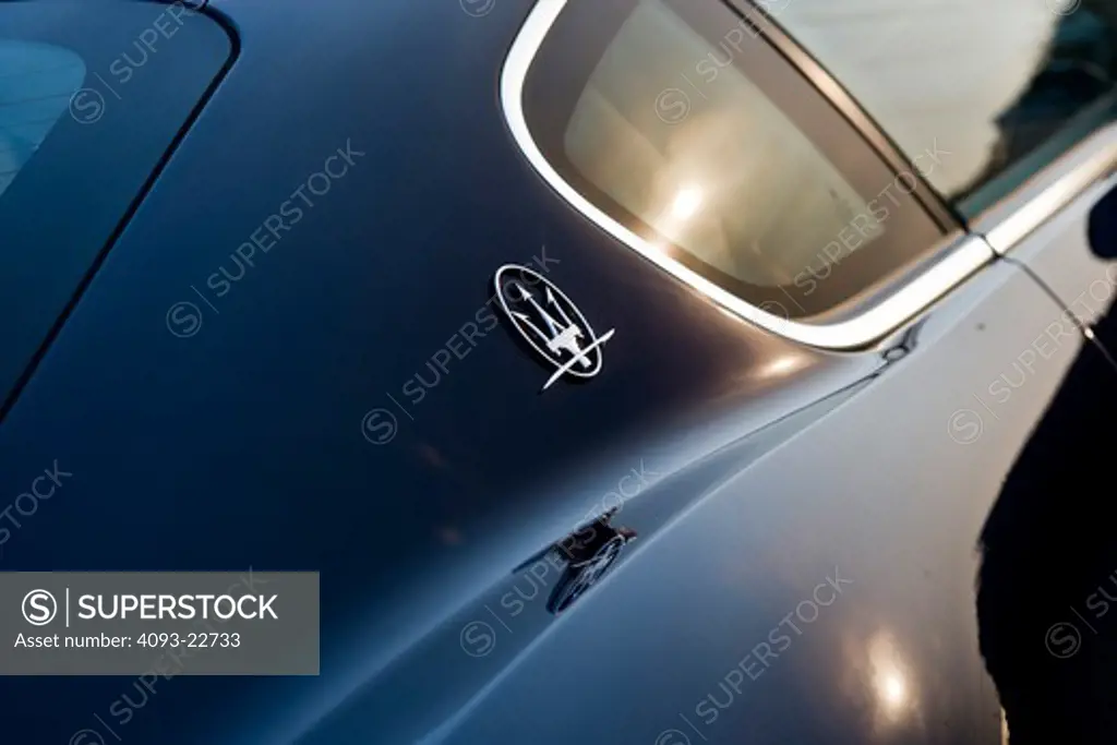 Exterior detail view of a 2009 Maserati GranTurismo S sports coupe showing the badge behind the side windows.