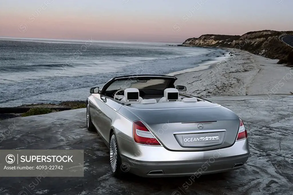 The Mercedes-Benz Ocean Drive is a concept car introduced in 2007. The car is built on the S600 sedan chassis. It's a four door convertible with a soft top. It's not known whether the car will be produced. Rear 3/4 view on a deserted beach.