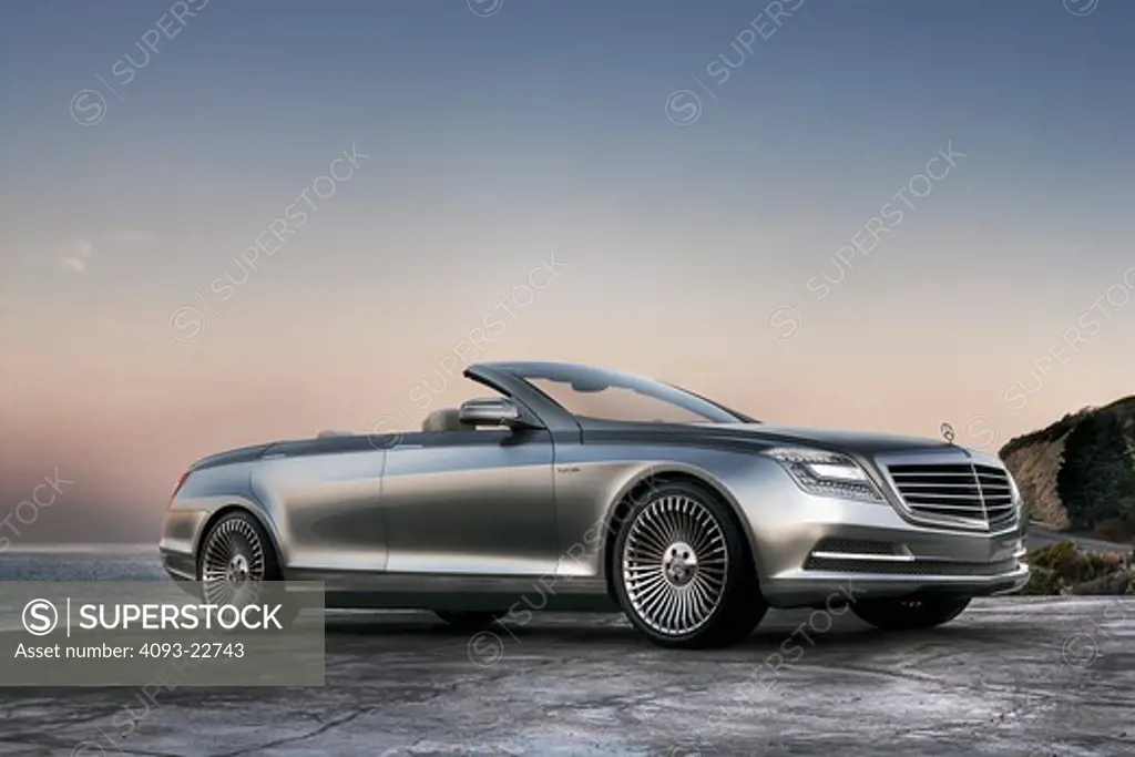 The Mercedes-Benz Ocean Drive is a concept car introduced in 2007. The car is built on the S600 sedan chassis. It's a four door convertible with a soft top. It's not known whether the car will be produced. Low, front 3/4 view on a deserted beach.