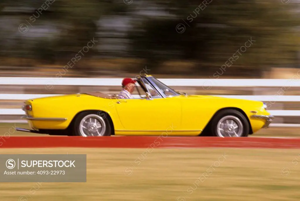 Maserati Mistral 1964 1960s yellow fence red curb