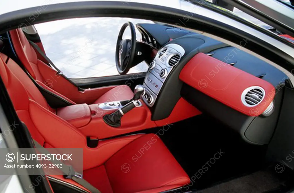 interior Mercedes Benz SLR 2005 red leather seats steering wheel black dashboard silver trim