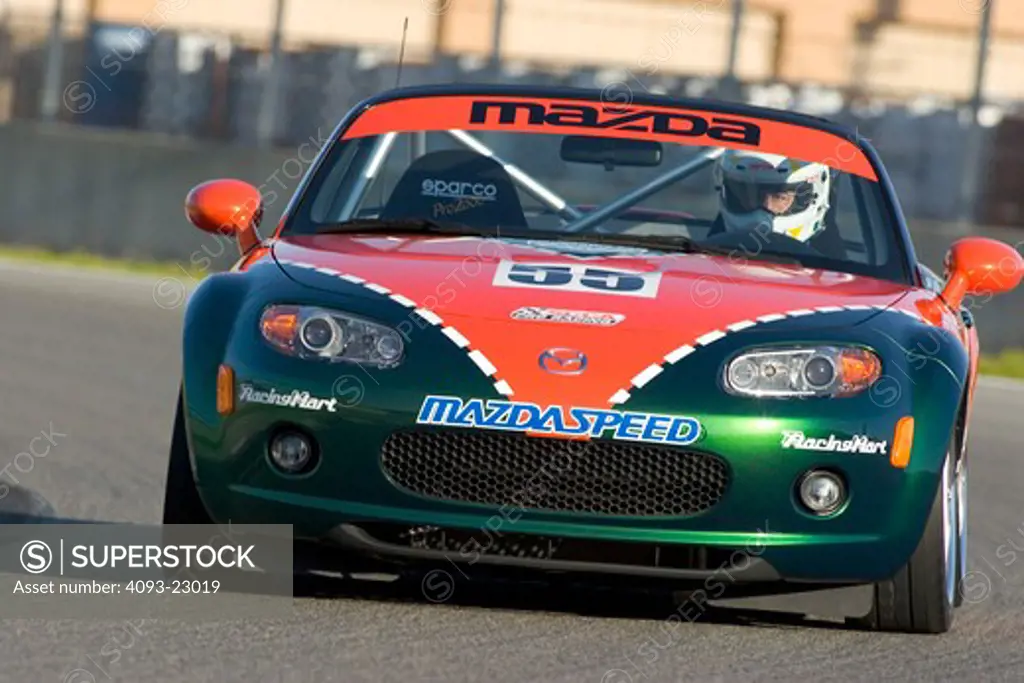 Mazda Miata MX-5 2006 Laguna Seca orange green turning cornering handling
