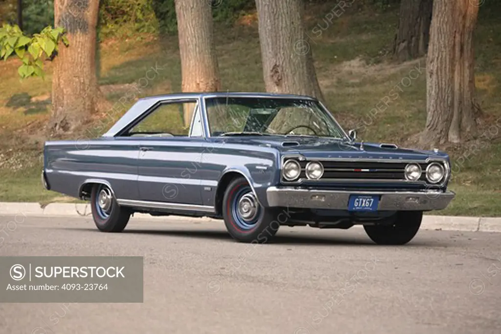 1967 Plymouth Hemi GTX The Plymouth GTX was introduced as the Belvedere GTX in 1967 by the Plymouth division to be a gentleman's muscle car. It was to be an exceptional blend of style and performance. in a residential area trees in the background