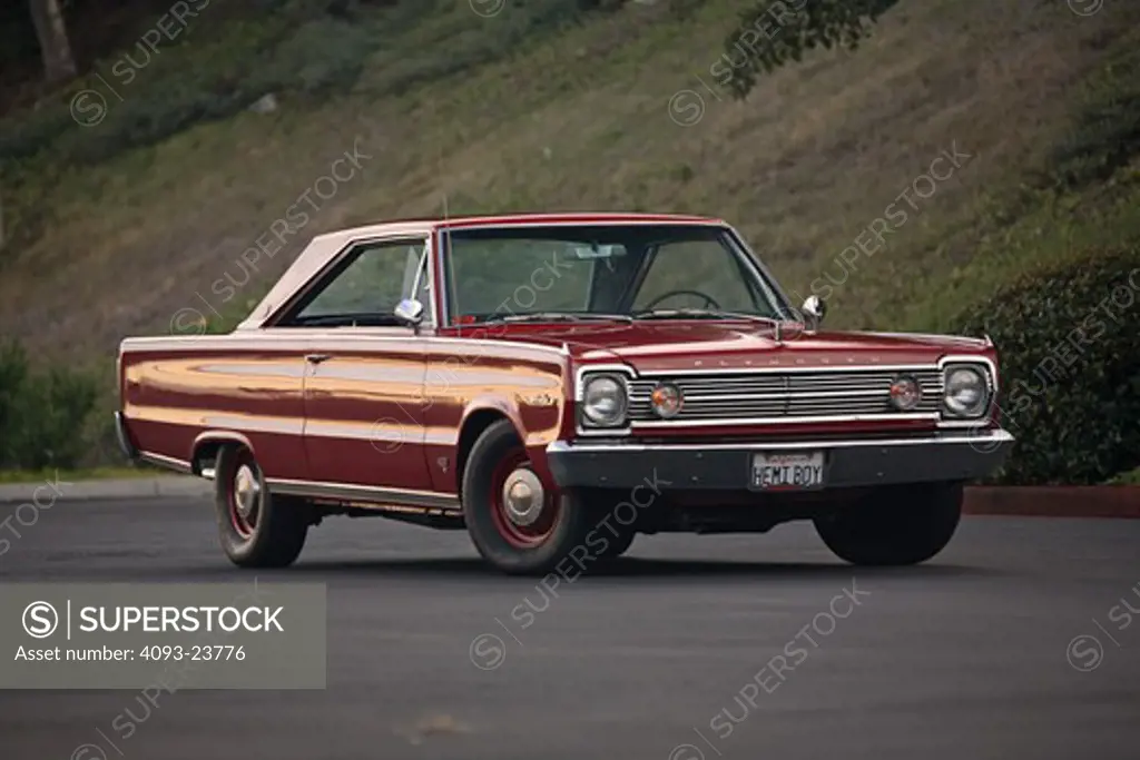 1966 Plymouth Hemi in an empty parking lot on pavement