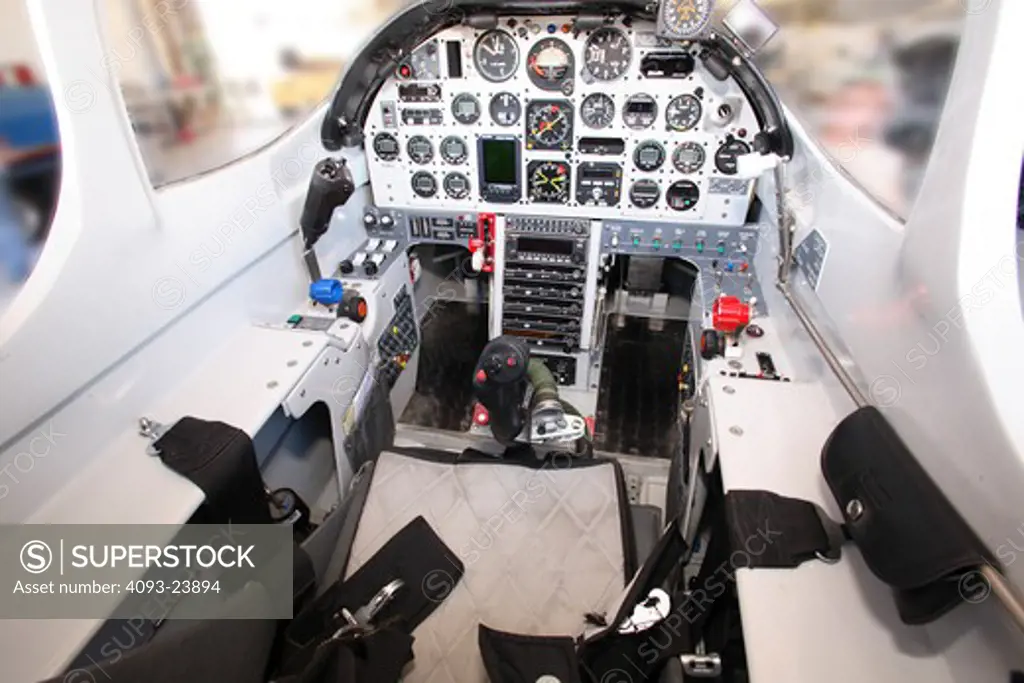 Interior view of the experimental, kit built Turbine Legend private plane. Showing the instrument panel, avionics, control panel, radios, flight controls, control stick and pedals. This is a turbine, turbo prop powered two seat fixed wing aircraft. Powered by a Walter turboprop. It can cruise at over 300 mph.