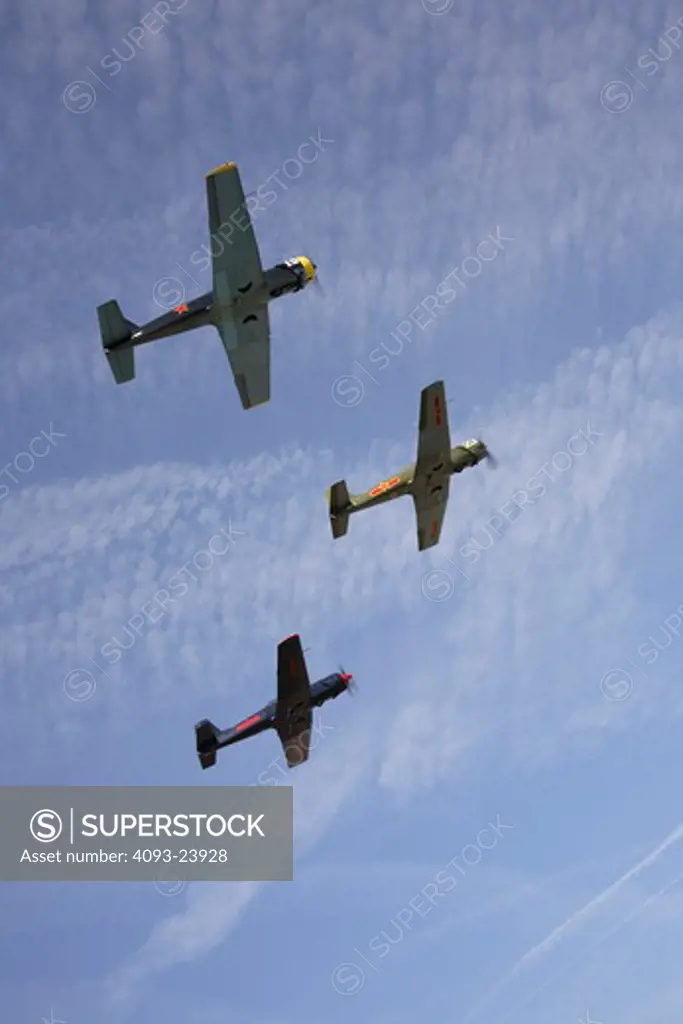 3 Chinese Nanchang CJ-6 military trainers in formation flight over Porterville, CA.