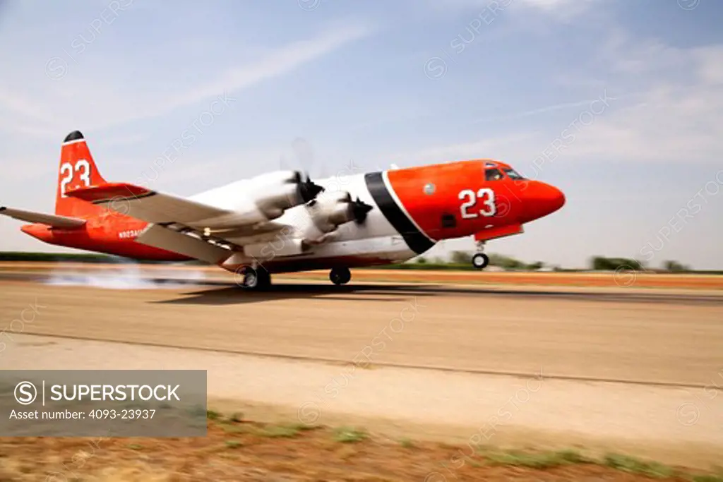 The Lockheed P-3 Orion is a maritime patrol aircraft used by numerous navies and air forces around the world. Many like this one are now used for aerial fire fighting. This one is landing at Porterville, CA airport.