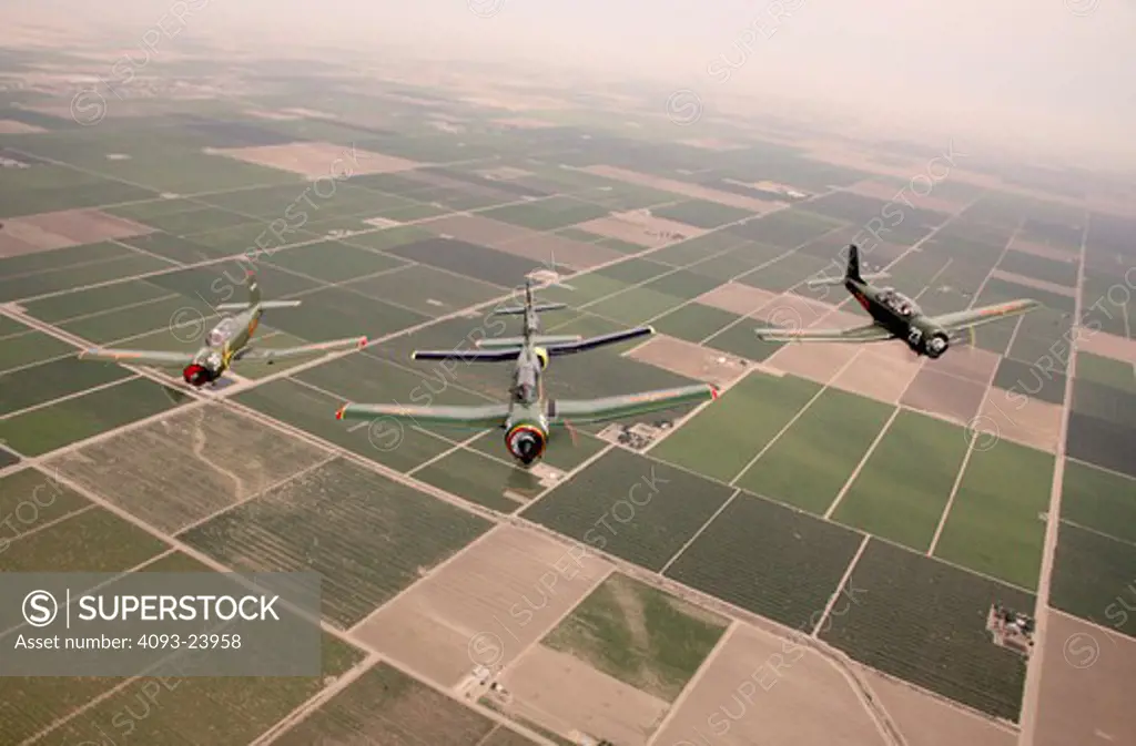 4 Chinese Nanchang CJ-6 military trainers in formation flight over Porterville, CA.