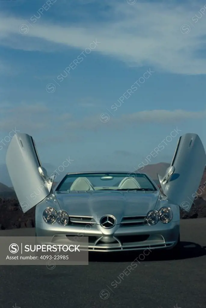 Mercedes Benz SLR McLaren hardtop silver open doors head on street