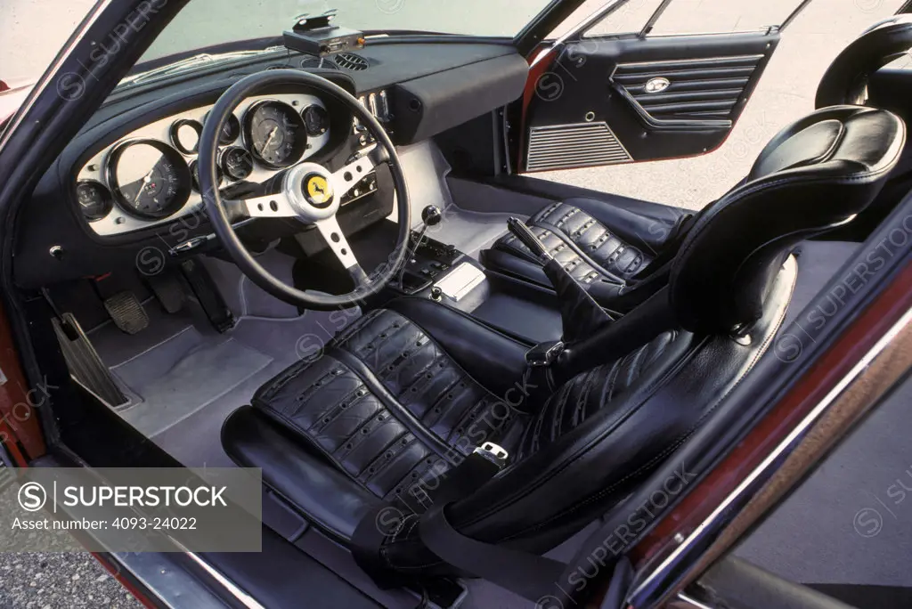 interior Ferrari Daytona 1970 black leather seats emergency brake steering wheel open door