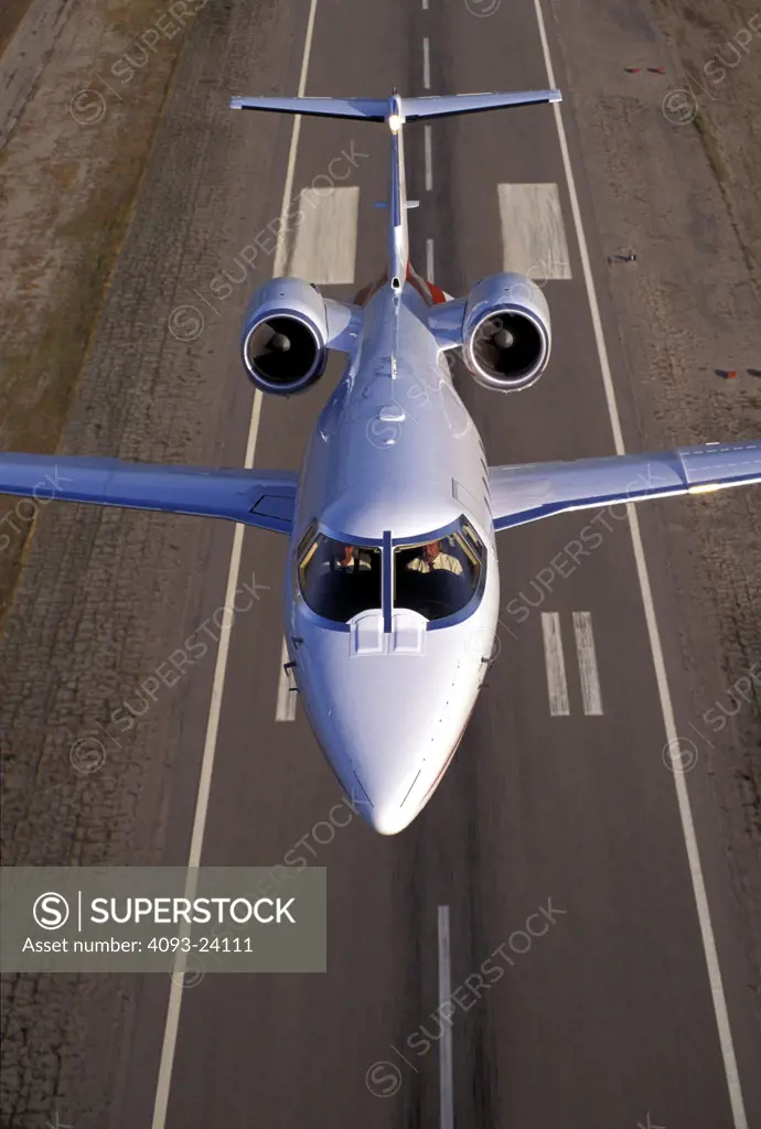 Learjet Jets Fixed Wing Aviat Airplanes 60 charter runway takeoff landing head on