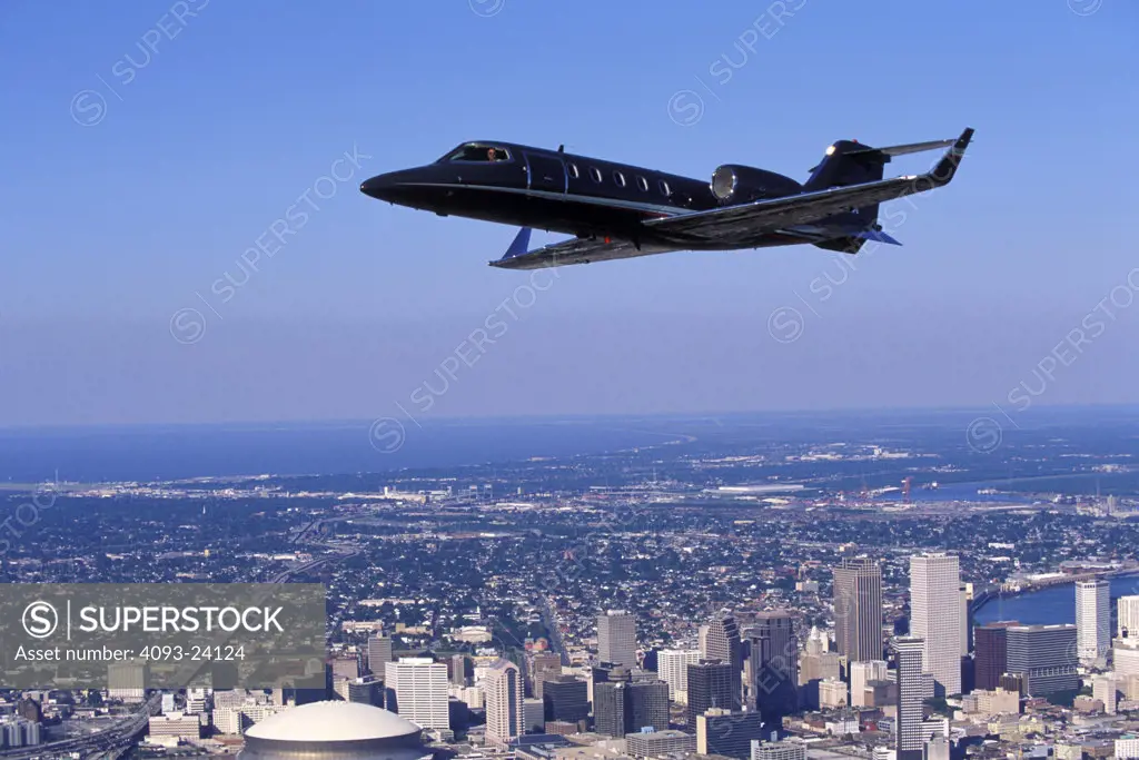 Learjet Jets Fixed Wing Aviat Airplanes 31A charter sky buildings skyline New Orleans city