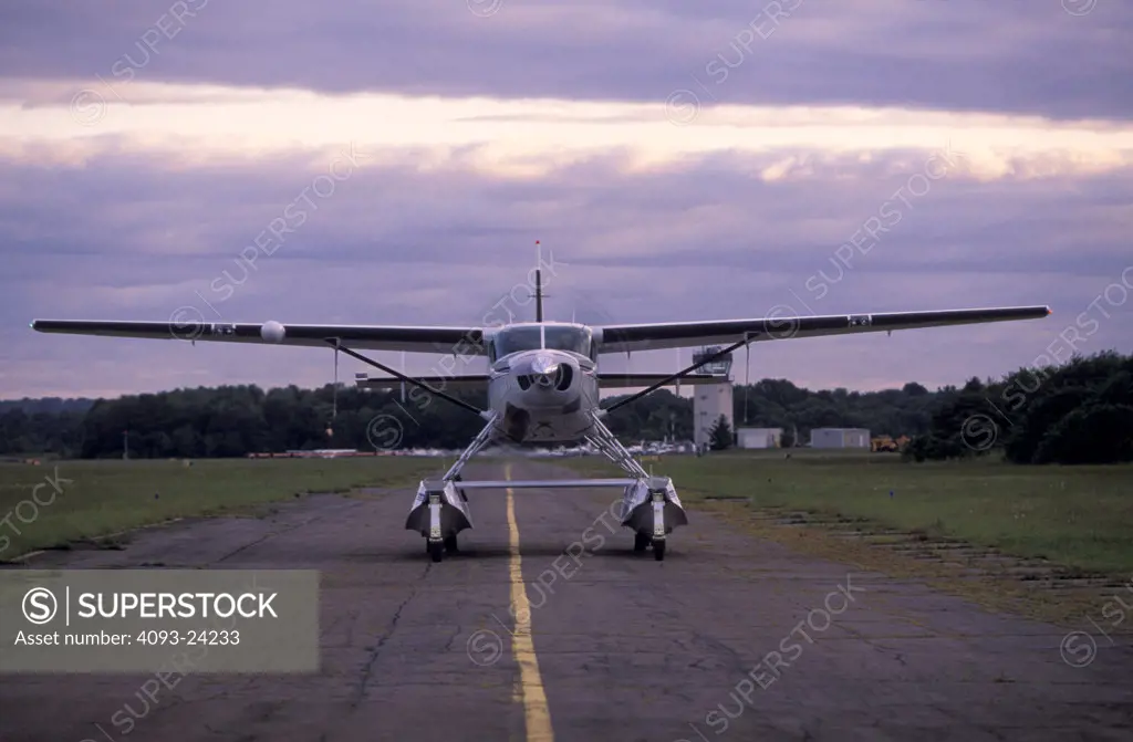 Prop General Aviation Fixed Wing Cessna Aviat Airplanes charter Caravan seaplane floats floatplane amphibian taxiing runway amphibious head on