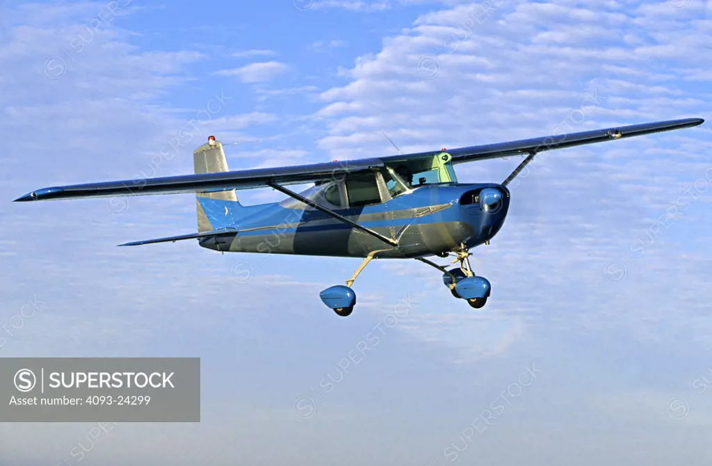 1959 Cessna C150 C 150 Fastback Straight Tail flying.
