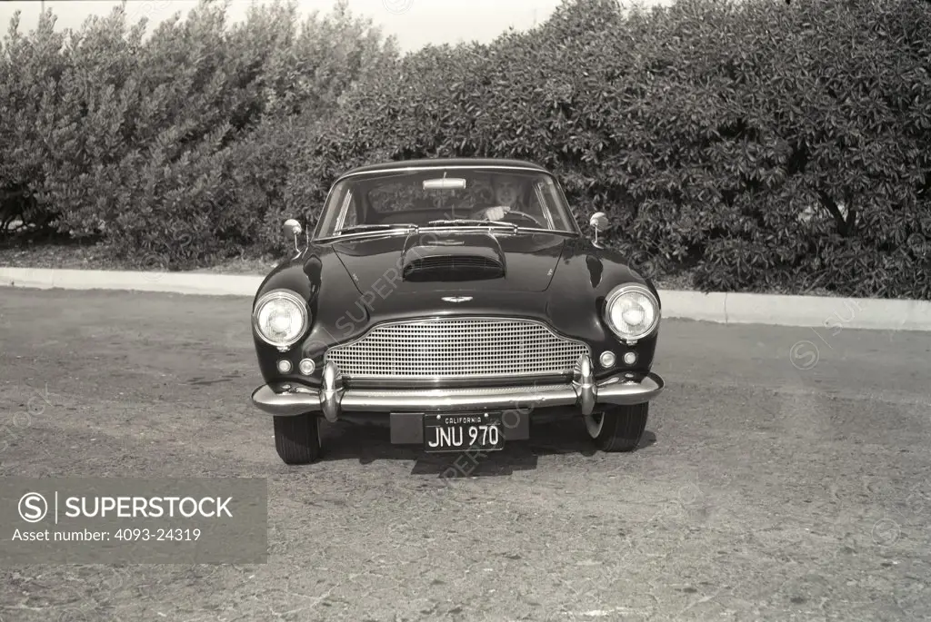 Aston Martin DB4 GT 1961 1960s period nostalgia head on street