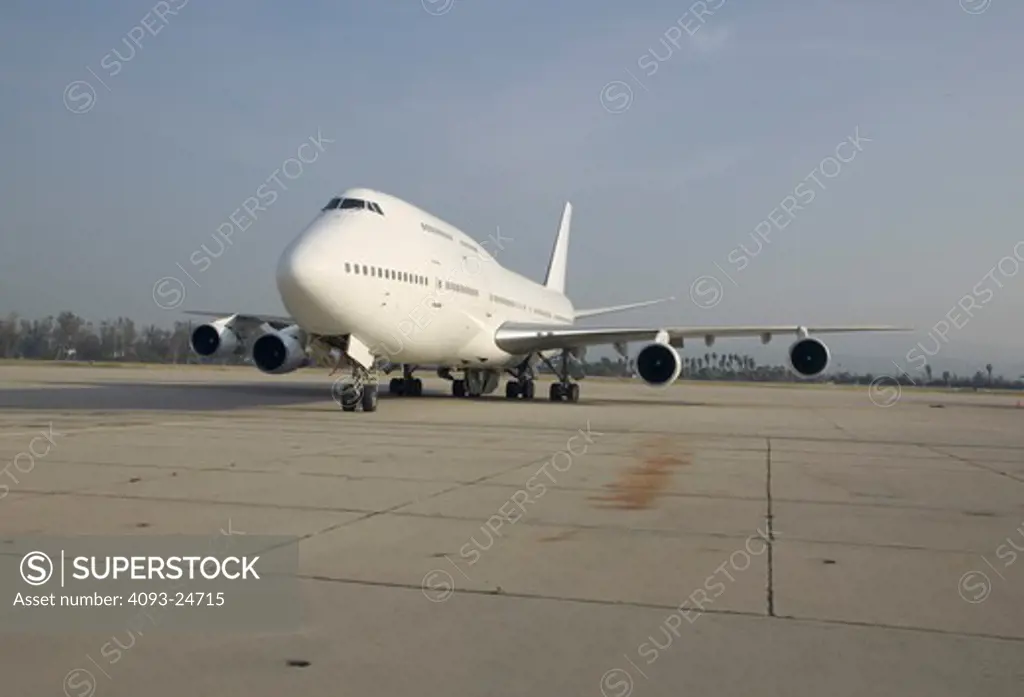 low angle Jets Fixed Wing Commercial Boeing Aviat Airplanes 747 runway white