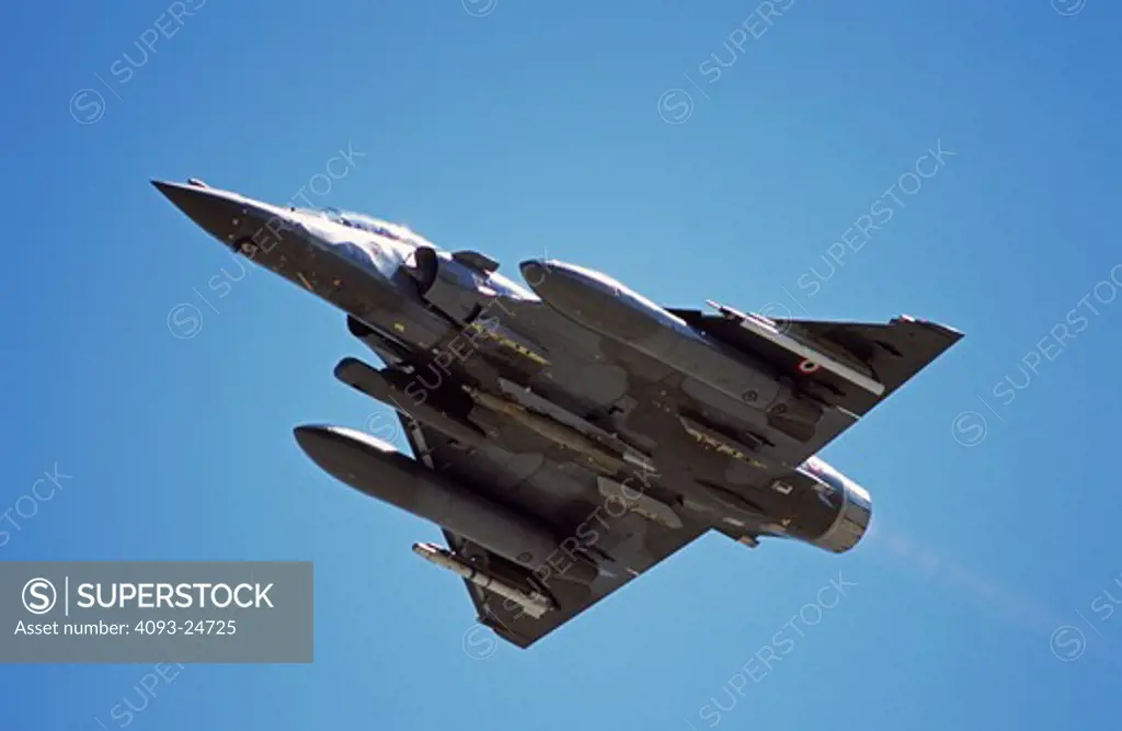 French Air Force Dassualt MFG  Mirage 2000 fighter-bomber taking off with 500 pound bombs/ordnance  laser designator and air to air missile. Taking part in Red Flag exercises at Nellis Air Force Base  Las Vegas  NV.