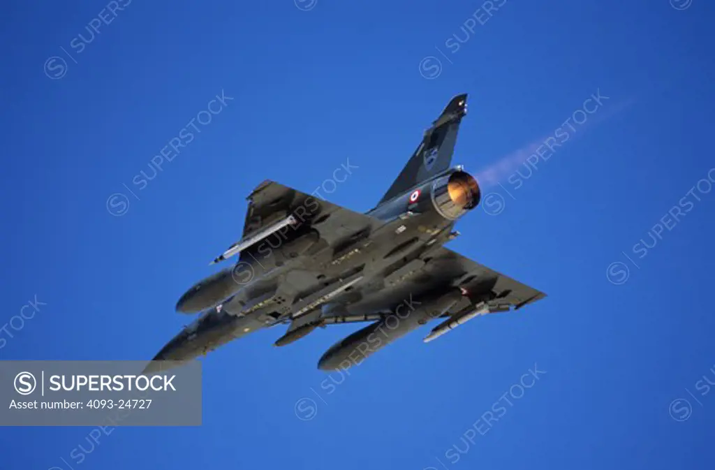 French Air Force Dassualt MFG  Mirage 2000 fighter-bomber taking off with 500 pound bombs/ordnance  laser designator and air to air missile. Taking part in Red Flag exercises at Nellis Air Force Base  Las Vegas  NV