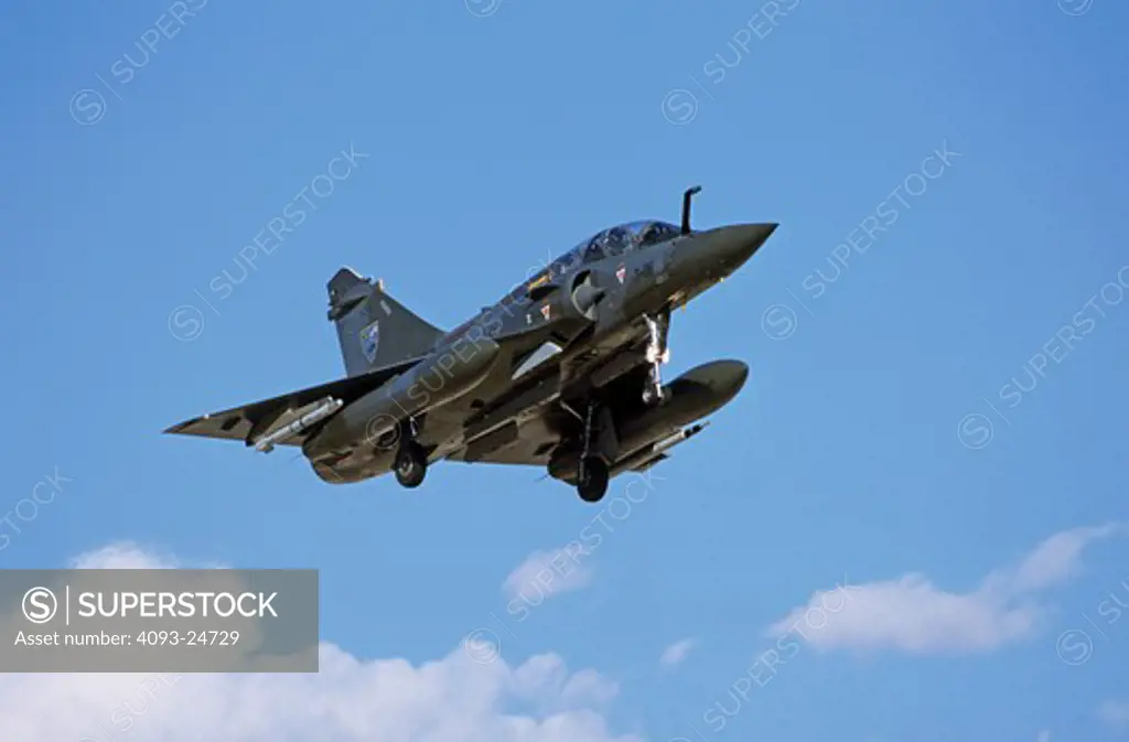 French Air Force Dassualt MFG  Mirage 2000 fighter-bomber landing after a bombing mission. Ordnance: laser designator and air to air missile. Taking part in Red Flag exercises at Nellis Air Force Base  Las Vegas  NV