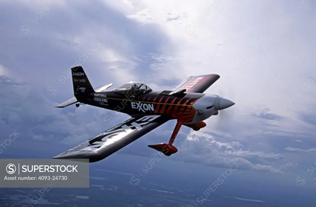 Bruce Bohannon flying his Exxon Flyin' Tiger. in which he has set more than 24 time to climb and altitude records nearing 50 000 feet altitude Air to air photos taken near Saint Augustine  FL. One of a kind airplane based on a Vans RV-4.
