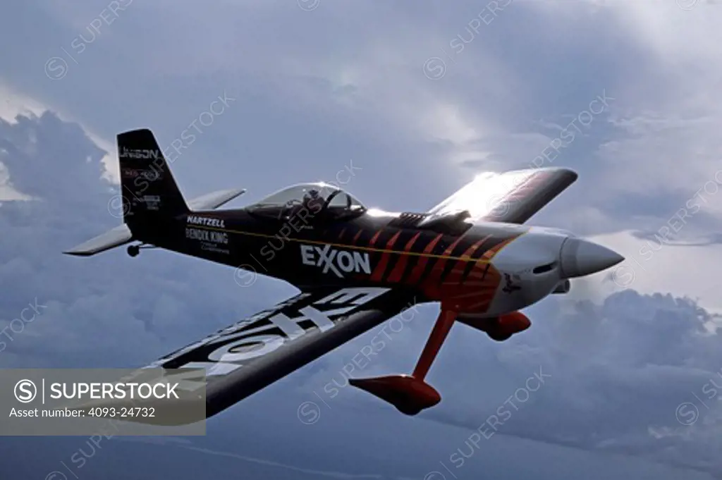Bruce Bohannon flying his Exxon Flyin' Tiger. in which he has set more than 24 time to climb and altitude records nearing 50 000 feet altitude Air to air photos taken near Saint Augustine  FL. One of a kind airplane based on a Van's RV-4.