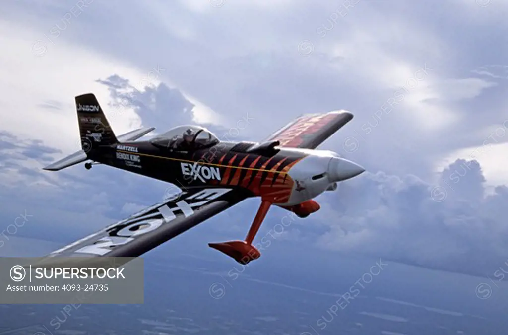 Bruce Bohannon flying his Exxon Flyin' Tiger. in which he has set more than 24 time to climb and altitude records nearing 50 000 feet altitude Air to air photos taken near Saint Augustine  FL. One of a kind airplane based on a Vans RV-4.