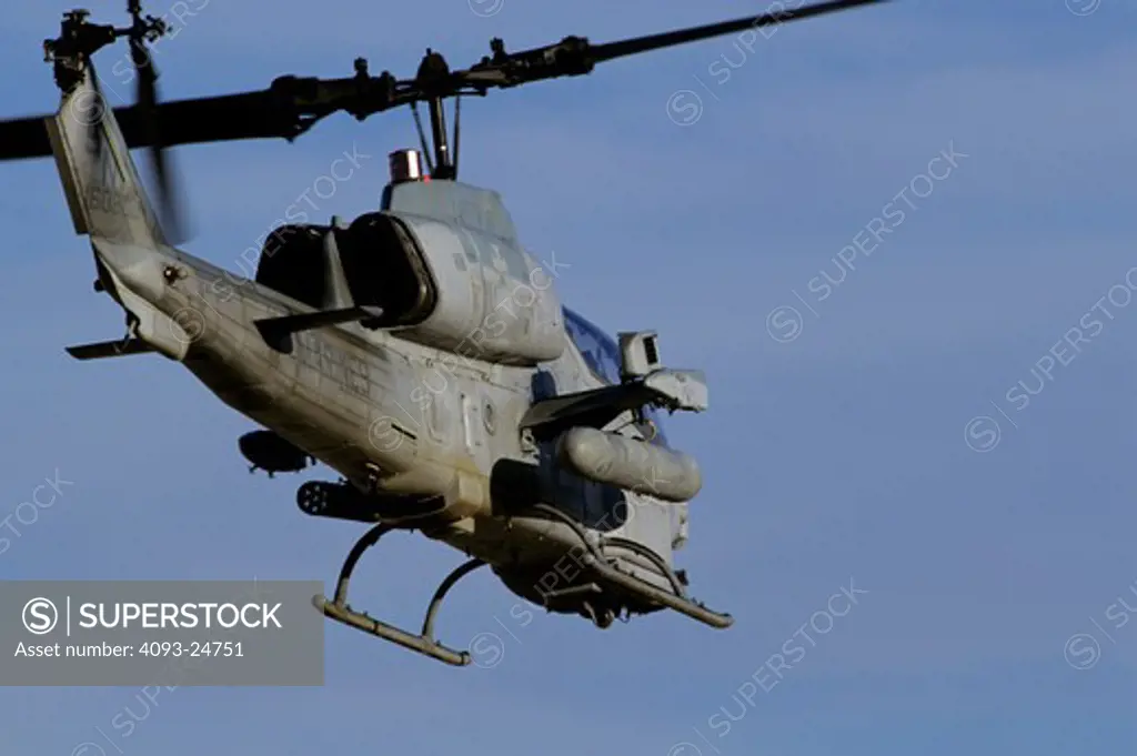 RVM000001US Marine Corps Bell AH-1 Cobra equipped with rocket launchers departs Naval Air Field El Centro during day to day training operations.