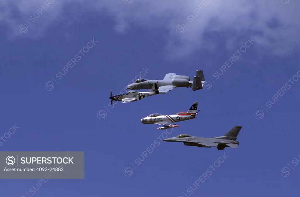 US Air Force Heritage Flight featuring civilian Lee Lauderbach in his North American P-51D Mustang Crazy Horse  with civilian Dale Snort Snodgrass on the left wing in his North American F-86 Saber  flanked by USAF A-10 Thunderbolt II ( Warthog ) and Lockheed F-16 Falcon ( Viper ).
