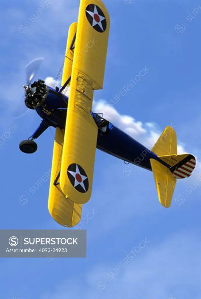 WWII vintage radial engine propeller driven Boeing Stearman biplane.
