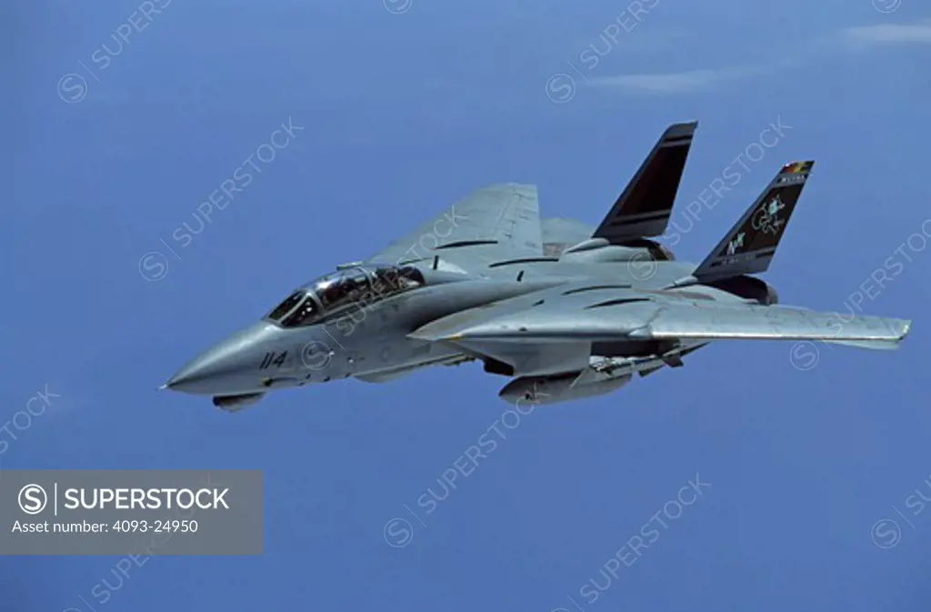 US Navy Grumman F-14D Tomcat of VF-31 Tomcat aka Felix photographed from a tanker over the Pacific Ocean. The aircraft is the squadron leader's color bird with more colorful markings