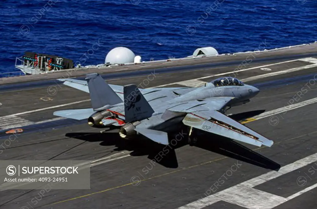 US Navy Grumman F-14D Tomcat of VF-31 Tomcat aka Felix on the deck of the USS Abraham Lincoln still engaged with the arresting cable