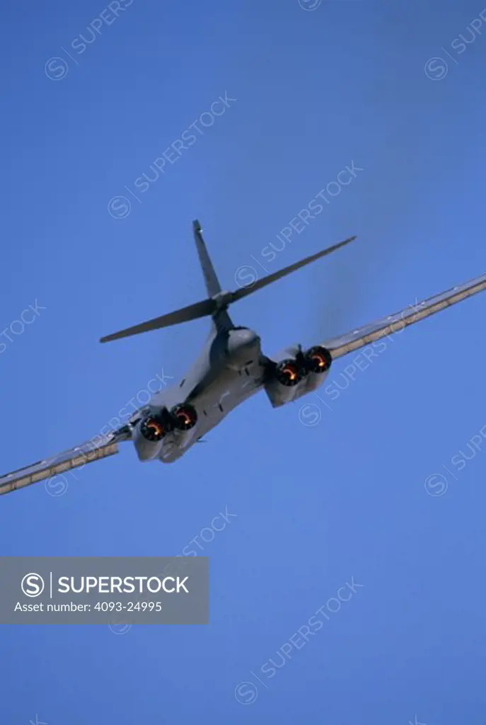 US Air Force Rockwell B-1B Bone (B-one) supersonic bomber  from behind  in afterburner