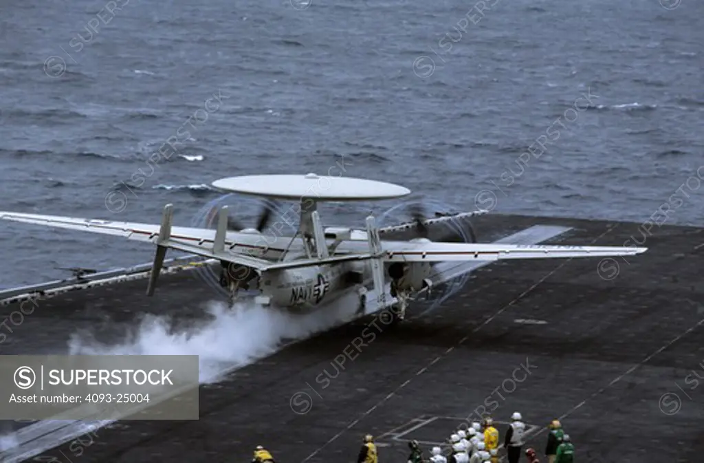 US Navy Grumman E-2C Hawkeye AWACS, airborne radar aircraft shoots from the bow catapult of the aircraft carrier USS Abraham Lincoln off the California coast