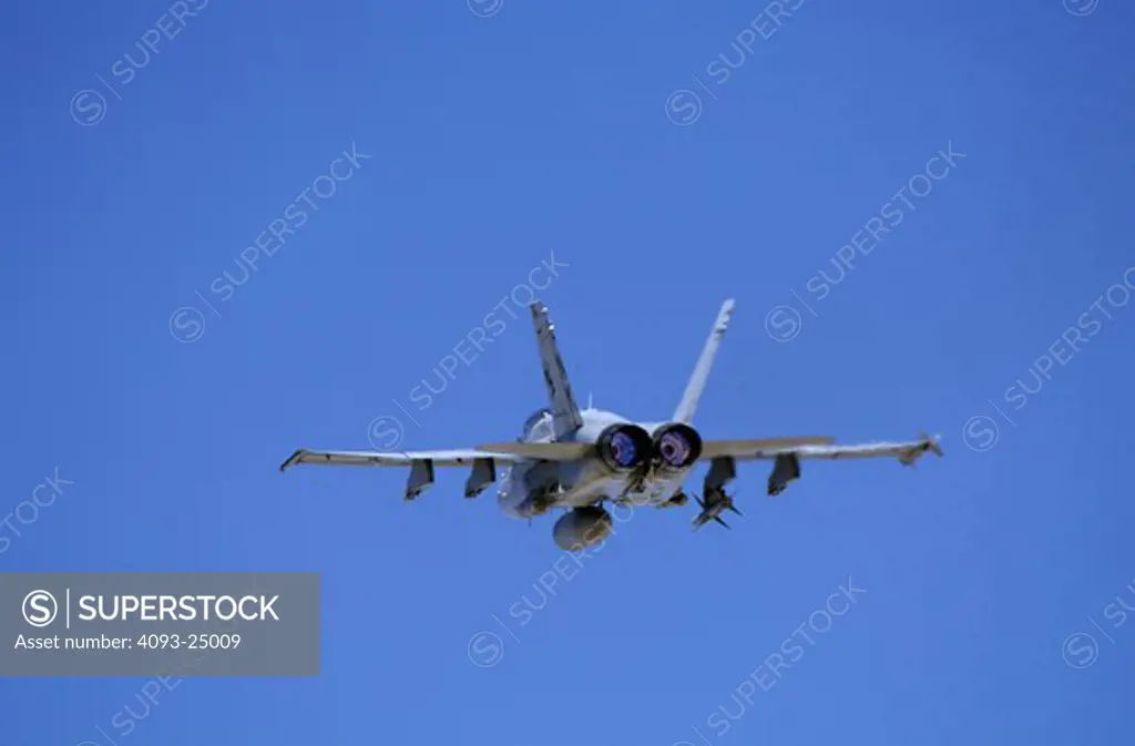 US Navy Boeing F/A-18C Hornet takeoff viewed from behind in afterburner with AGM-88 Harm anti-radiation missile, ordnance