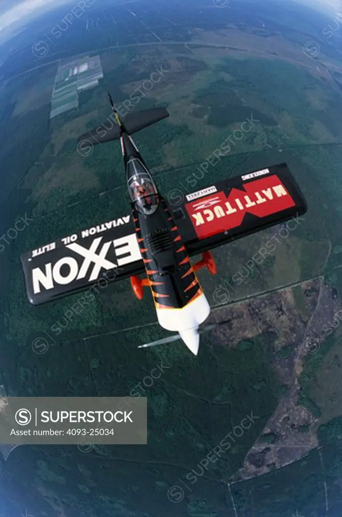 Bruce Bohannon flying his Exxon Flyin' Tiger. in which he has set more than 24 time to climb and altitude records nearing 50 000 feet altitude Air to air photos taken near Saint Augustine  FL. One of a kind airplane based on a Vans RV-4